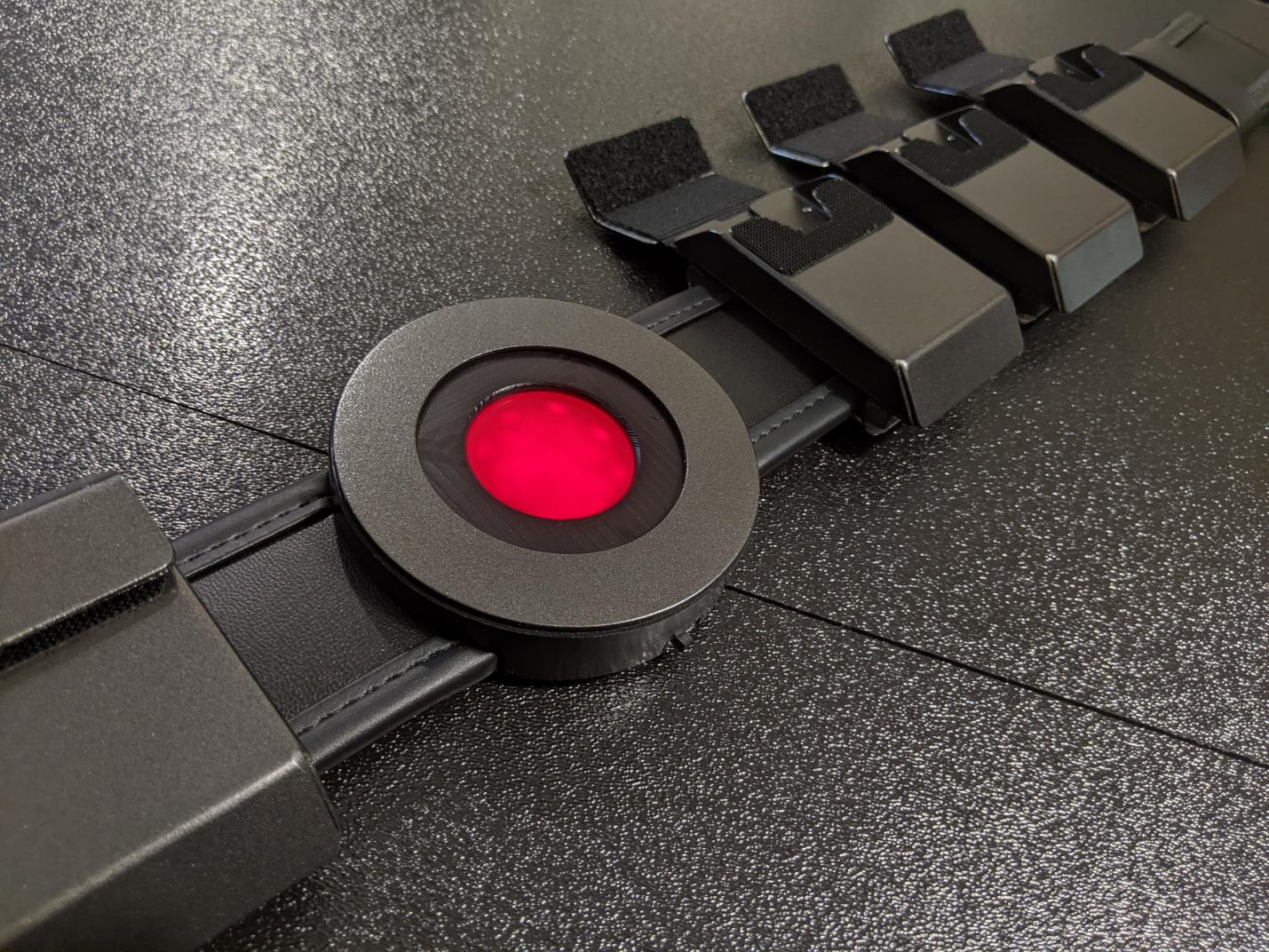 Metal batman beyond utility belt with functional aluminum pouches glowing red belt buckle and leather belt