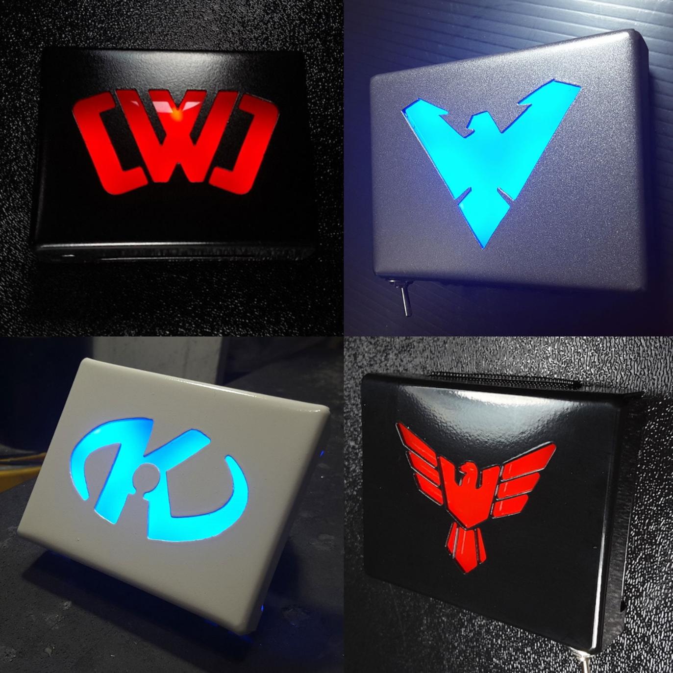 Various glowing metal belt buckles with different symbols