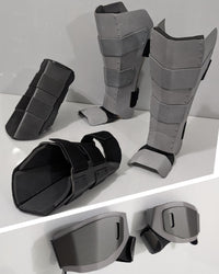 protective metal real superhero armor shin gaurds and a metal gauntlet with padding and hand armor