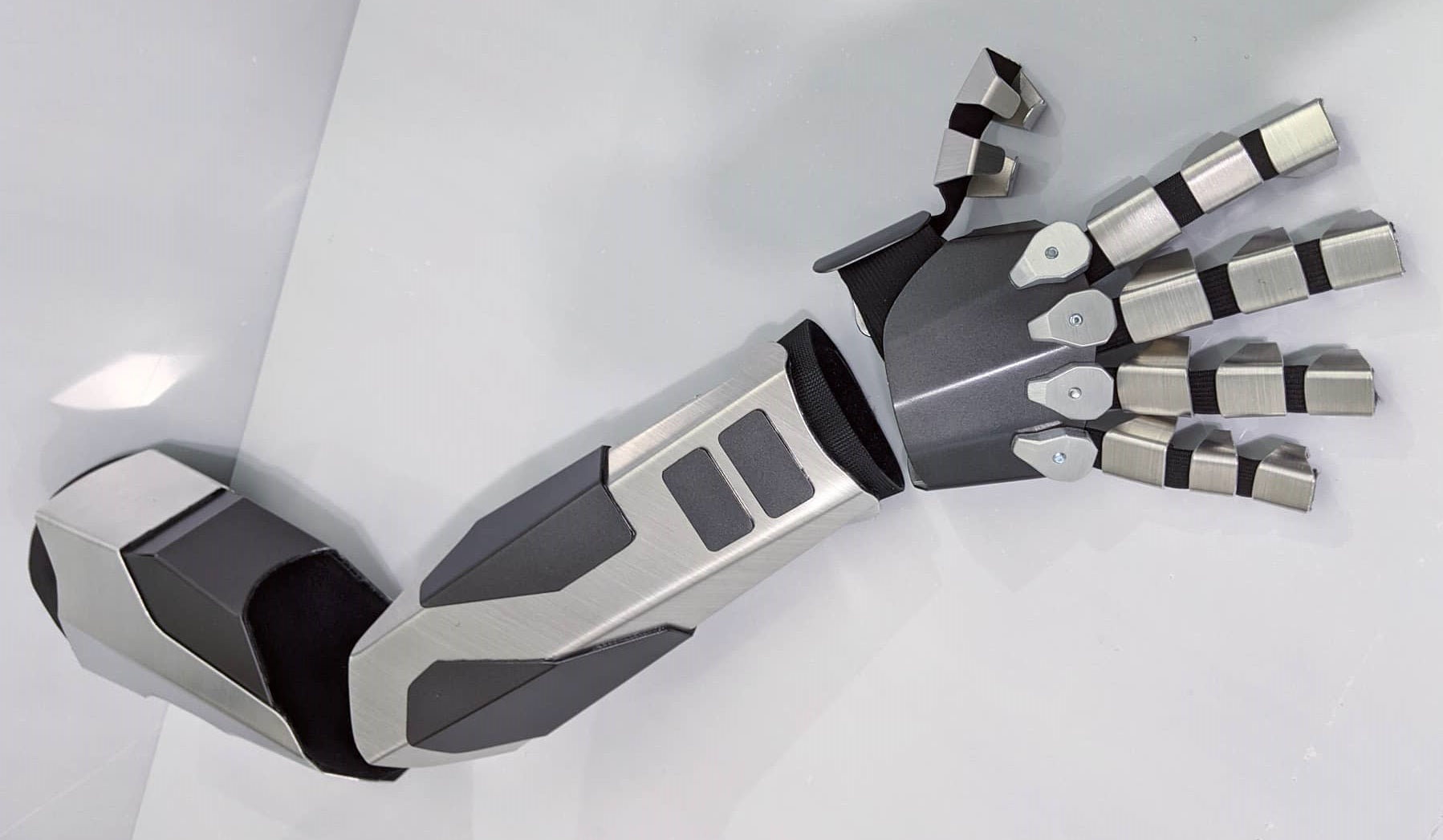 sleek robotic armor covering from shoulder down to the fingers