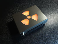 Glowing led metal belt buckle with radiation symbol