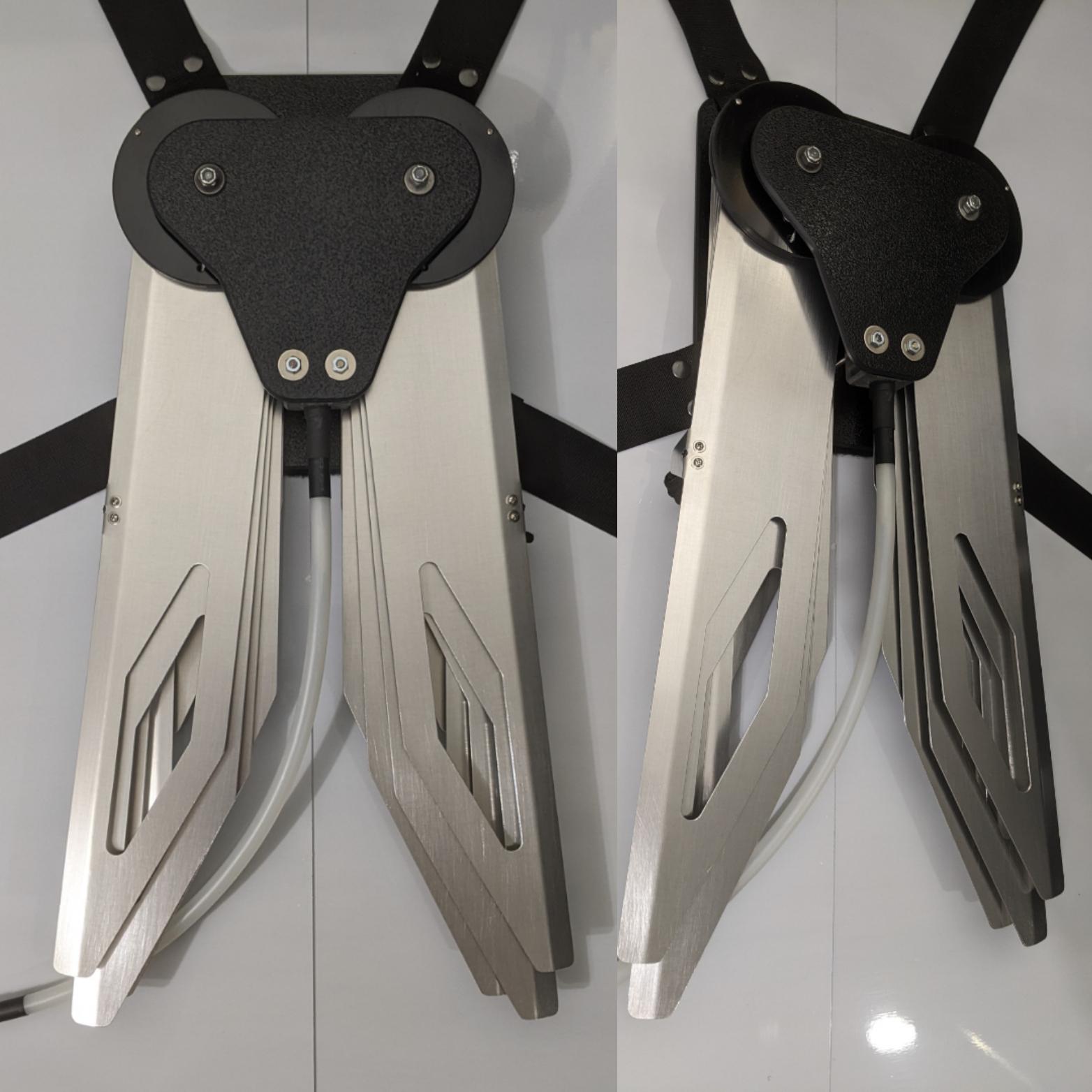 Costume black and silver metal mechanical wings that open and close with a pull cord