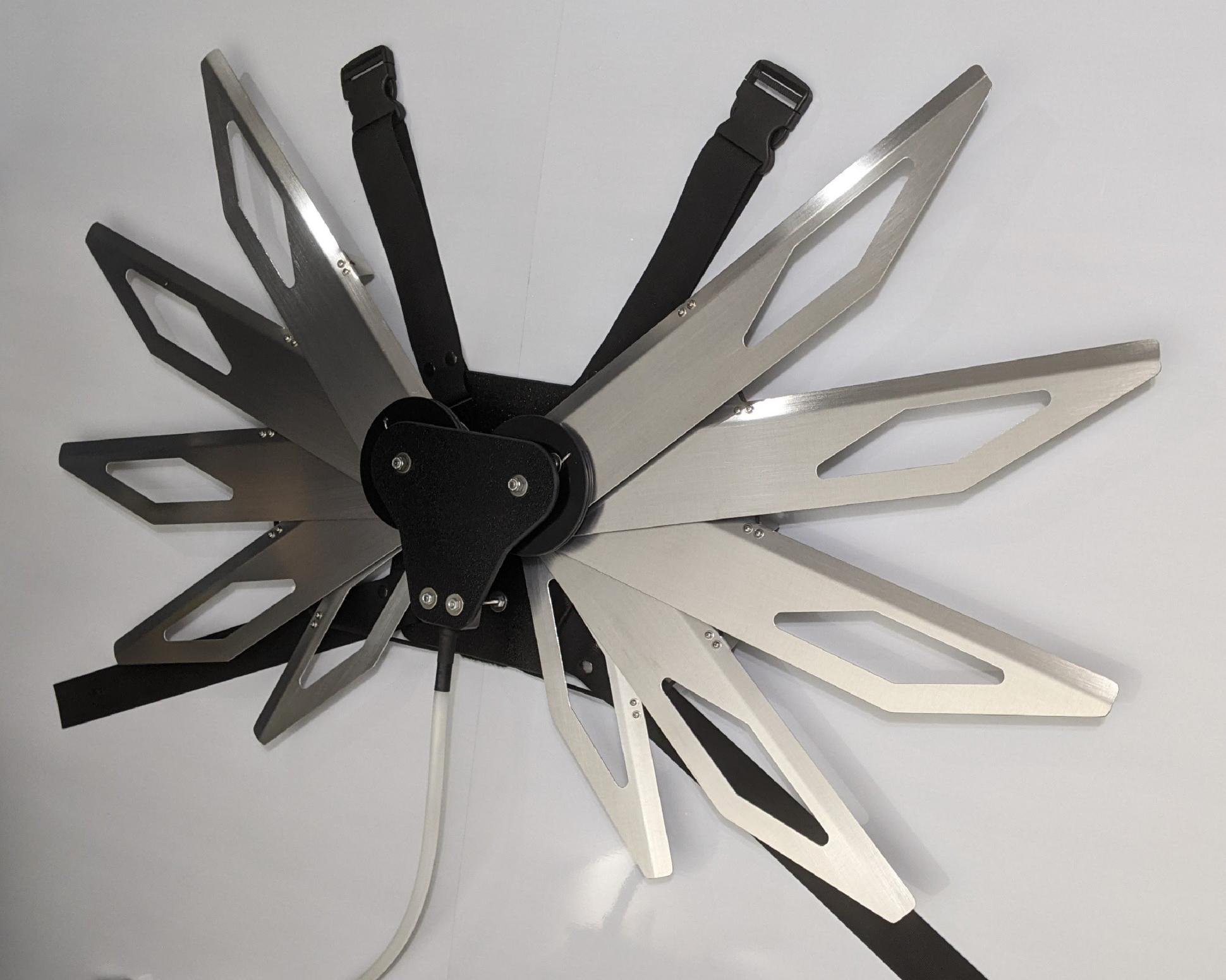 Costume black and silver metal mechanical wings that open and close with a pull cord