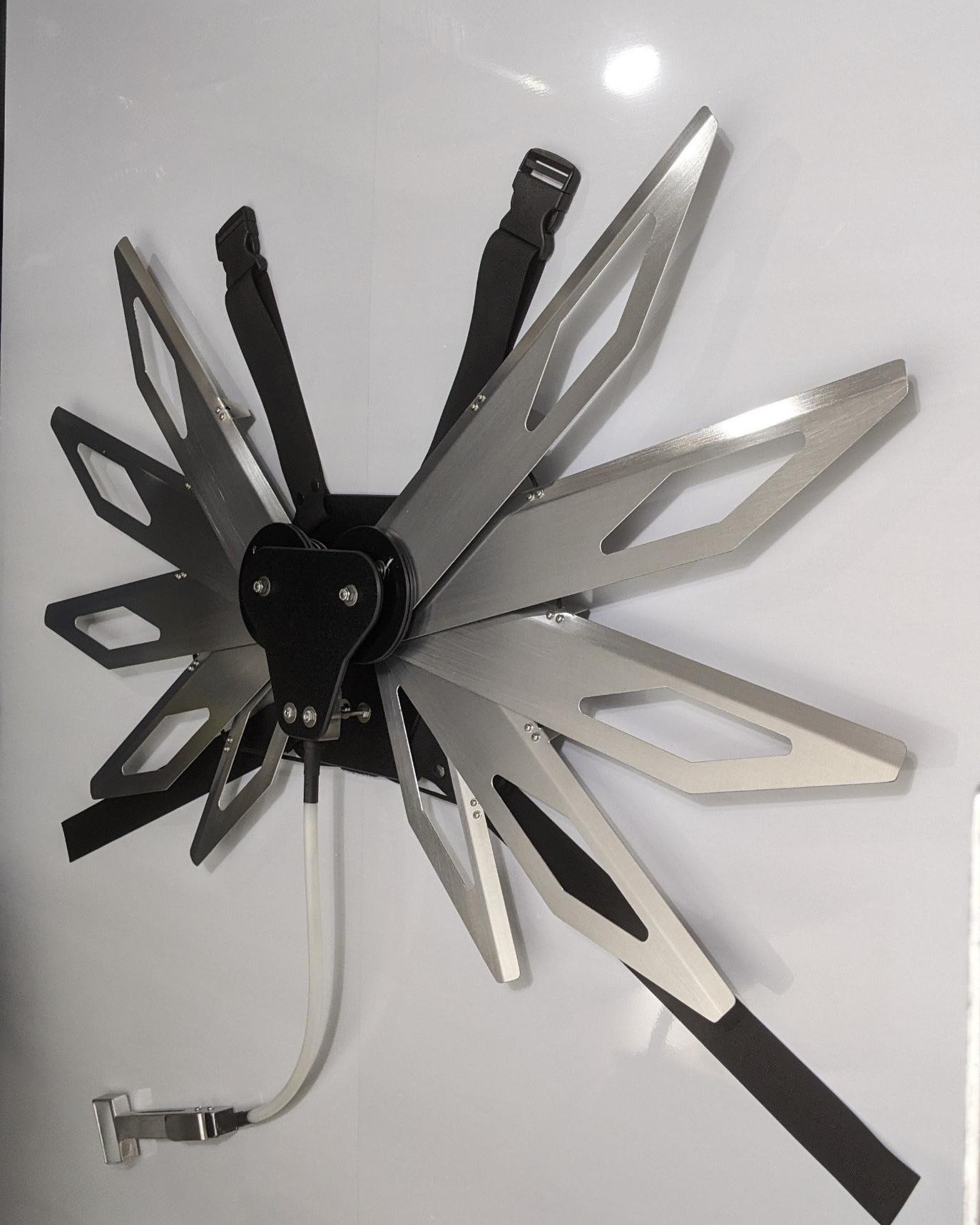 Costume black and silver metal mechanical wings that open and close with a pull cord