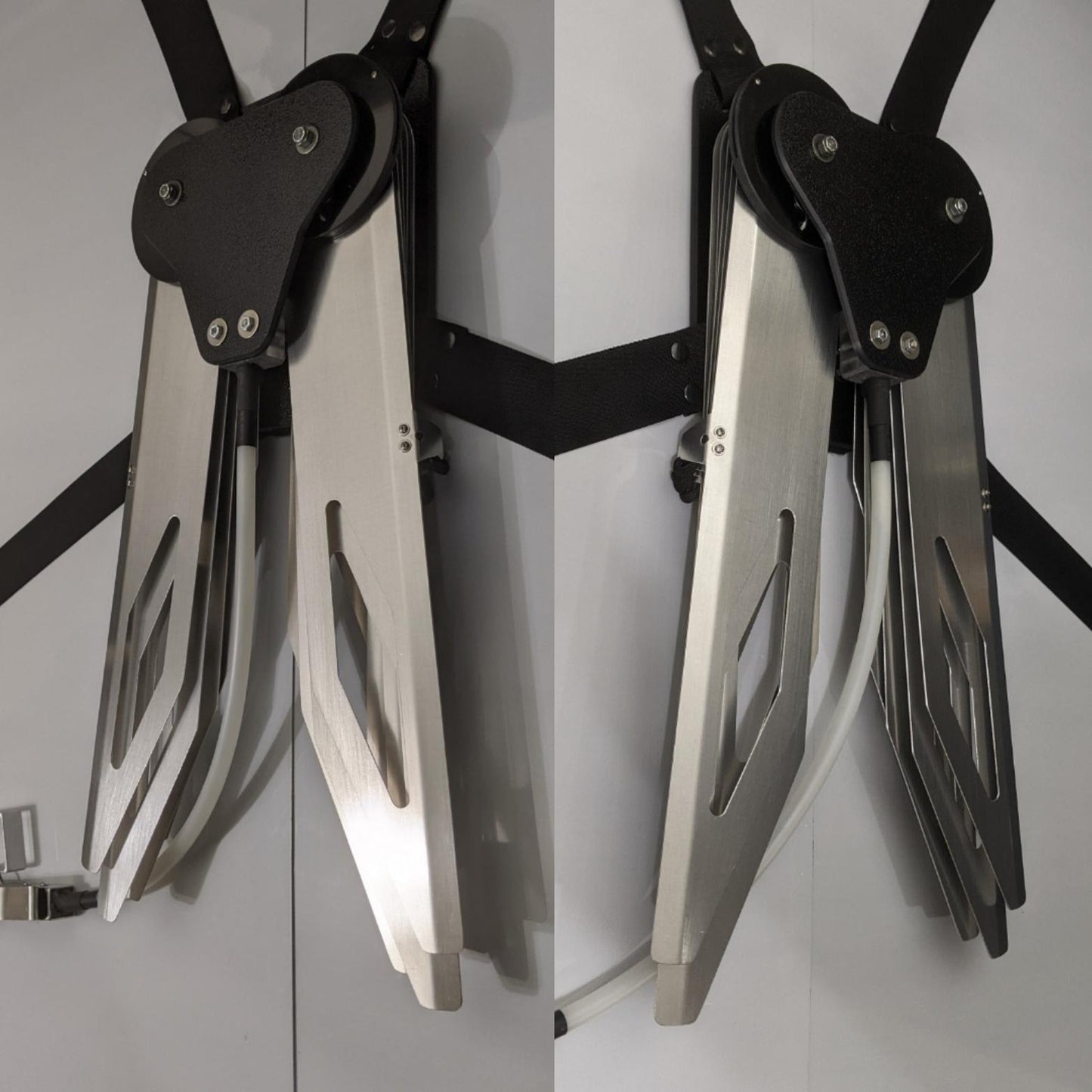 Costume black and silver metal mechanical wings that open and close with a pull cord