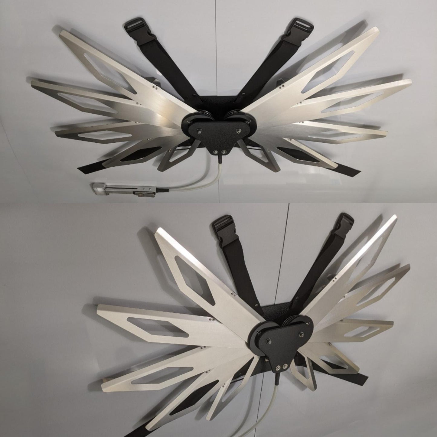 Costume black and silver metal mechanical wings that open and close with a pull cord