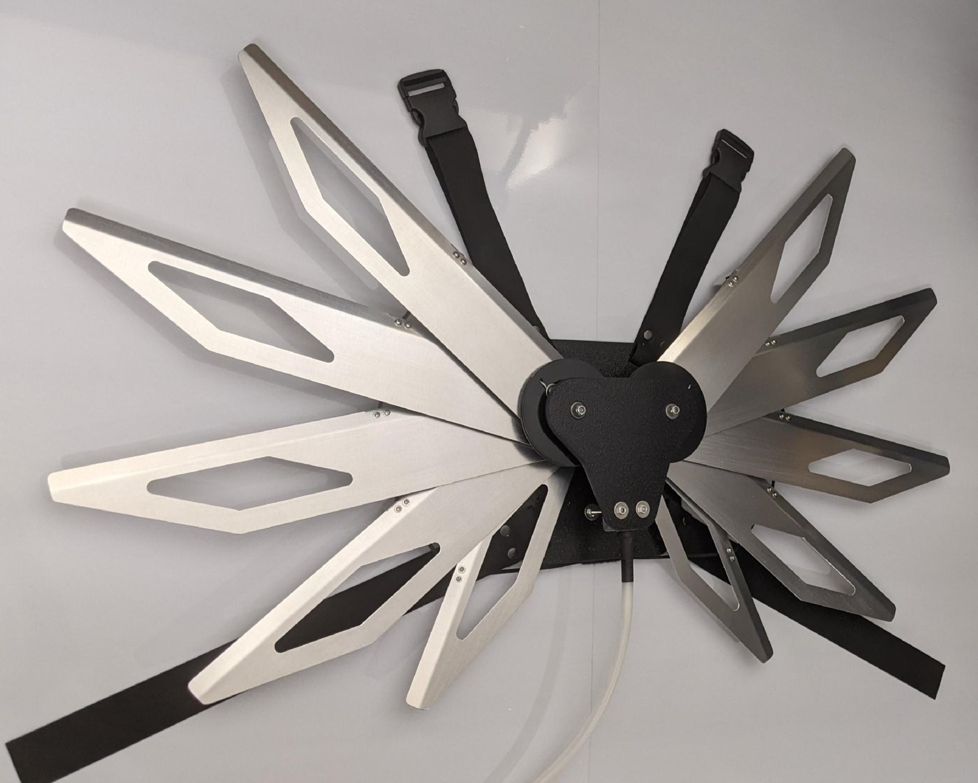 Costume black and silver metal mechanical wings that open and close with a pull cord